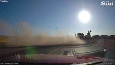 Woman launches her car over a busy overpass, between two sets of power lines, and walks away with minor injuries