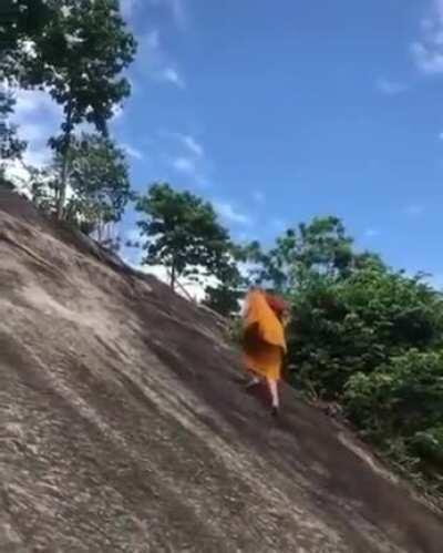 Monk Climbs Extremely Steep Hill Like it’s Nothing. Climber Records in Awe.