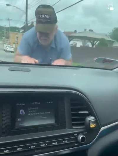 MAGA dumbfuck jumps on the hood of a car because he went down a one way the wrong way