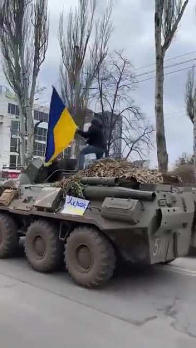 Don't mind me, while I'll just raise the Ukrainian flag over the moving russian column.