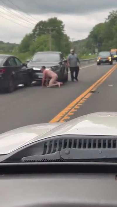 Man gets into head-on collision and exits his car completely nude.