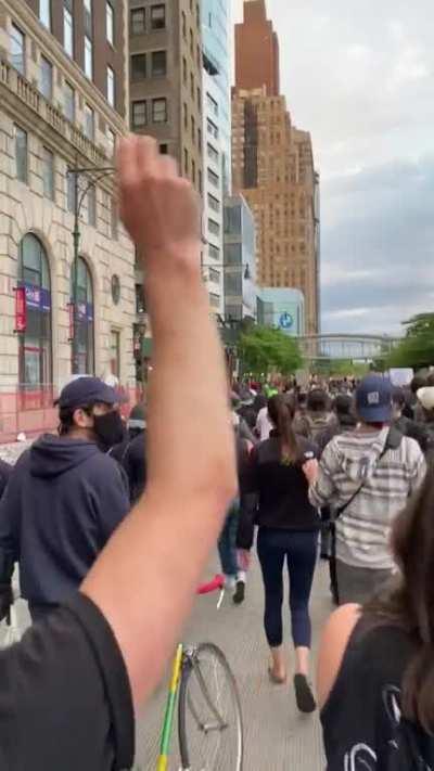 Watch the girl in the white hat. Cop shoves into her and then starts punching. Yesterday in NYC