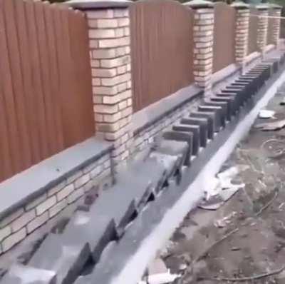 This man laying bricks