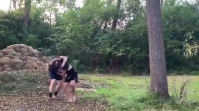 Girl kicks shorter guy after he wins a fair fight against tall dude 