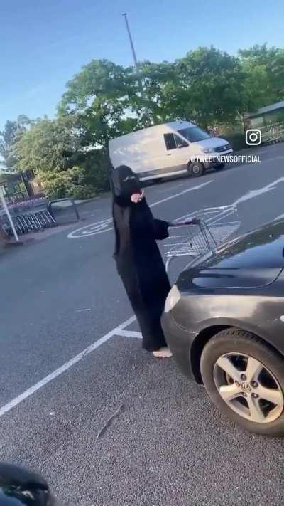 Muslim woman thinks she is allowed to incorrectly park her car because she wears a hijab and abaya, thinks anyone who speaks out is 