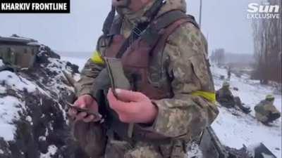 Footage of a Ukrainian soldier showing off captured Russian patches near Kharkiv