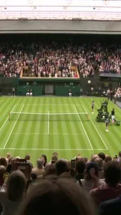 The Center Court crowd rises for eight-time Wimbledon Champion Roger Federer