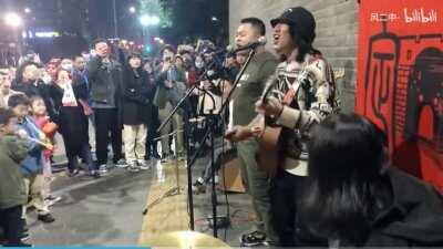 People singing The Internationale in the streets in Xi'an, China.