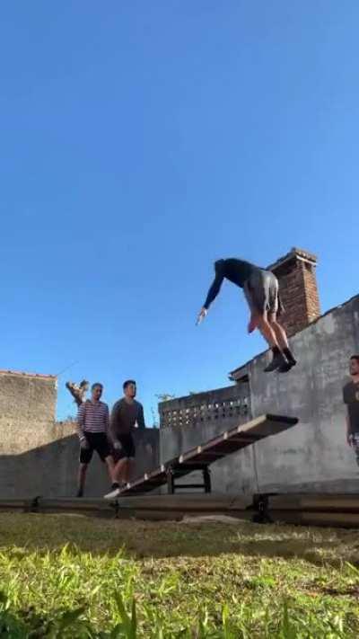 Acrobatics on a seesaw.