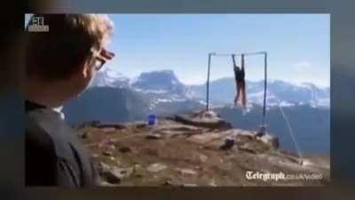 HTDYL Swinging on Monkey bars next to a cliff