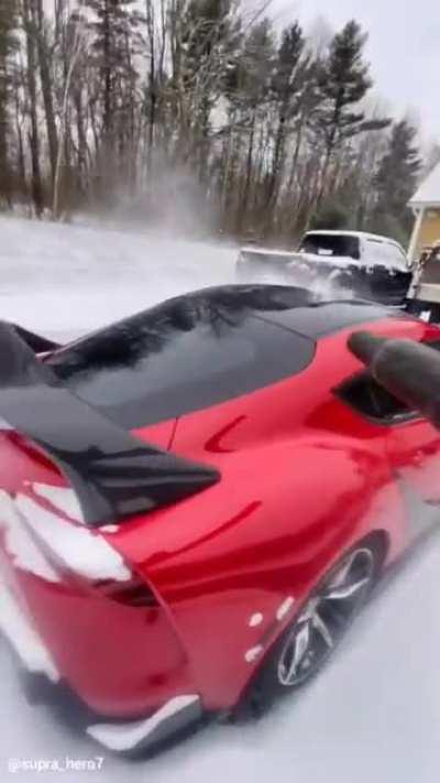 cleaning snow off a car