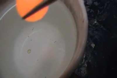 Red hot nickel ball in water creates a nice sound