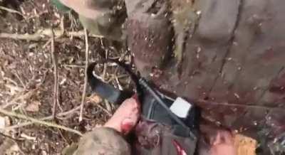 Translated: A Ukrainian combat medic provides first aid to two wounded Ukrainian soldiers.