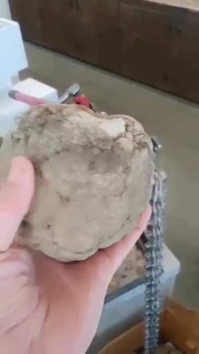 Man opens large geode