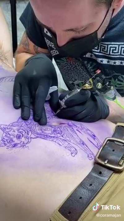 A terrible tattoo of a cat