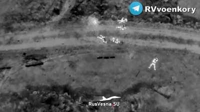 Thermal camera view of a grenade drop on a group of Ukrainian soldiers. Near Avdiivka, January 2024.