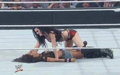 Paige crawling on top of AJ