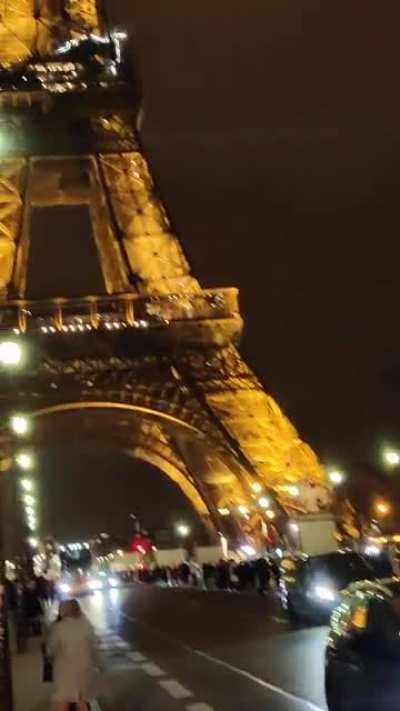 Standing in the middle of a busy road at the Eiffel tower