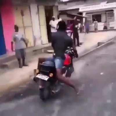 WCGW riding a motorcycle backwards