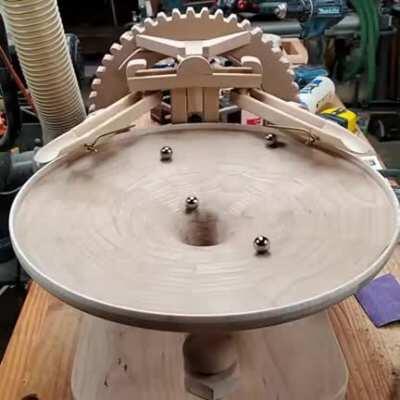 Insanely precise home- end selfmade wooden funnel for marbles, making sure not a single marble hits another [not OC]