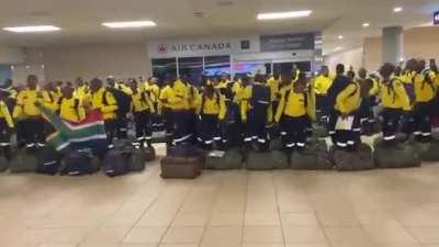 South African Fire Fighters Preform a Traditional Dance As They Arrive In Canada To Battle The Relentless Wildfires