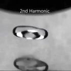 Harmonics through an acoustically levitated droplet of water