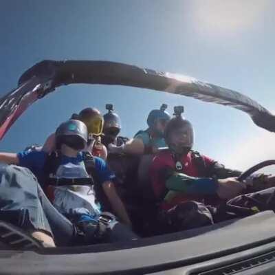 Skydiving while in a car.