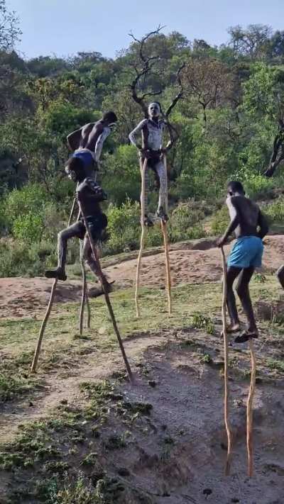 Bonna tribe in Africa - What practical use case of this Alien Walk? Escape lions? Cross river? Adulthood rights?