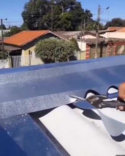 Handcutting the ridge of a metal roof