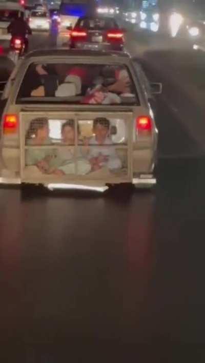 Travelling with your children in an unsafe cage on a busy highway