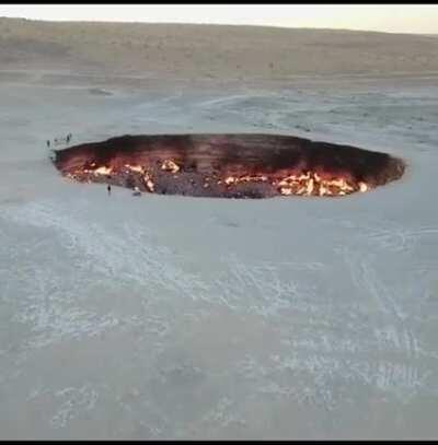 Darvaza Gas Crater or Gates of Hell, is a natural gas field collapsed into a cavern located in Derweze, Turkmenistan. It has been burning since 1971