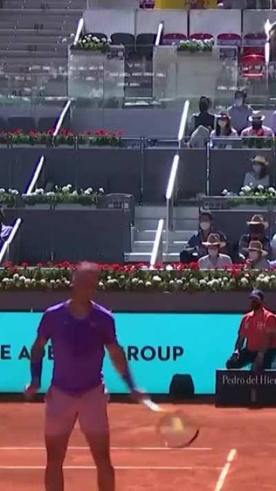 Rafael Nadal catches opponent's shot with his racket