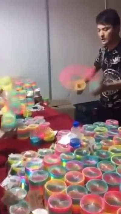 This guy knows how to play with Slinky Rainbow Toy.