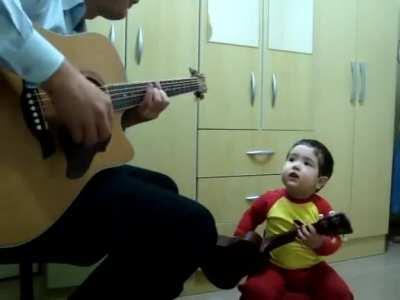 Found this on YouTube and thought it belonged here. A father and son jamming together to Don't Let Me Down by The Beatles