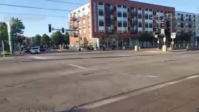 Someone just stole a dumpster and used it for cover while cops tried to shoot him in Minneapolis