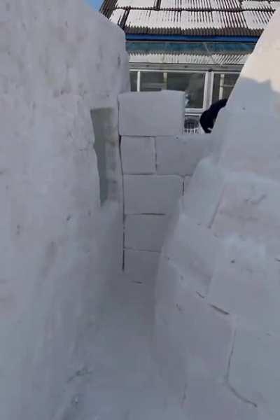 building a snow house from snow bricks