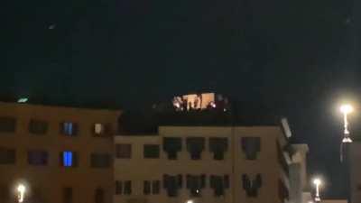 A dude with an electric guitar and an amp plays ‘We Are The Champions’ on his rooftop across Piazza Navona after Italy wins the Euro 2020