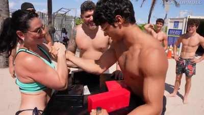 Irina Gladkaya, the 13-time female world champion arm wrestler takes on the men of Muscle Beach, Miami