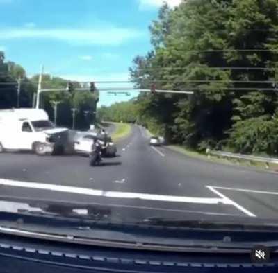 Motorcyclist threads the needle of death