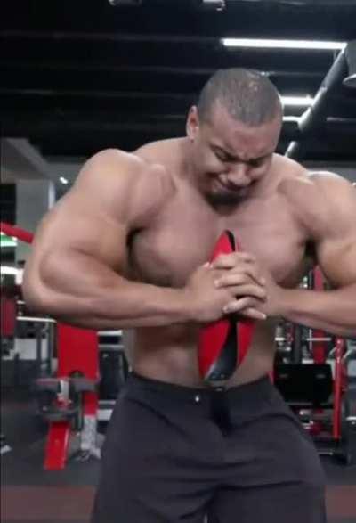 Powerbuilder Larry Wheels crushing a pan with his bare hands