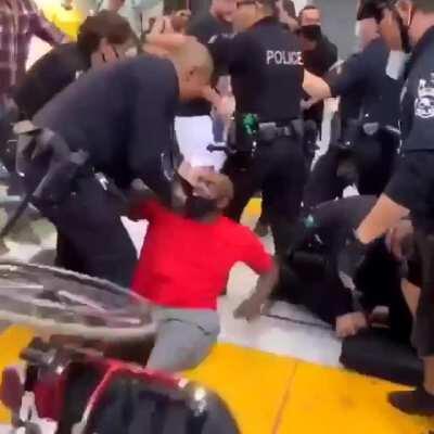 Gangs of LAPD Beating Up Peaceful Wheelchaired- Protestor