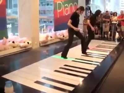 These two girls killing it on a floor piano