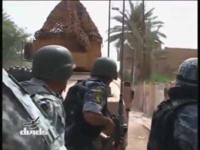 Humvee turret gunner is almost killed by accurate rifle fire, US soldiers and Iraqi police then push down the street in sherch of the shooter (Sadr City, Baghdad, 2008)