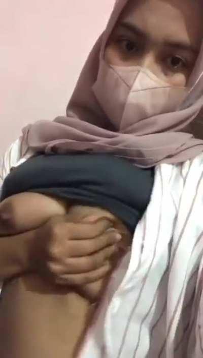 Indonesian girl playing with her boobs