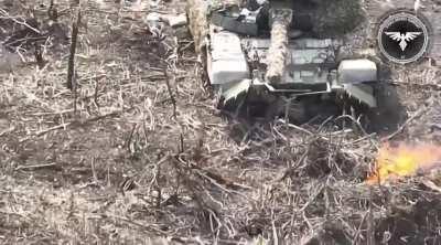 Russian soldiers hide under their abandoned tank but are attacked by Ukrainian FPV drones, the tank is then destroyed in a catastrophic explosion after a second drone attack (Avdiivka area, April 2024)