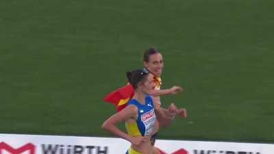 Laura García-Caro coming in for European bronze in the 20km walk, with her flag, starts to celebrate just before the line …