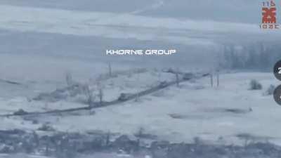 Ukrainian artillery disables a Russian tank leading an armored column driving towards Krasnohorivka. 16 december 2023 (music from source) (at 48.20956, 37.7354)