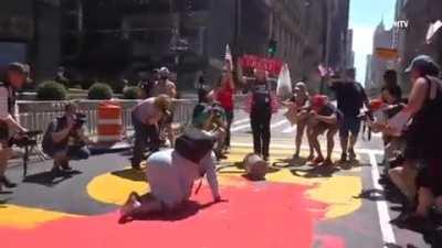 Trump supporter vandalizing a BLM mural