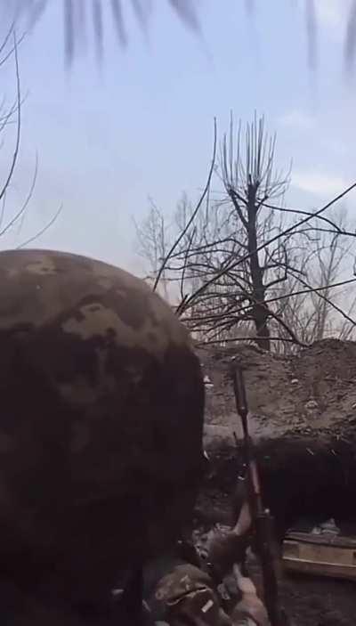 Ukraine, 2022, April or May: two Ukrainian soldiers defend their position