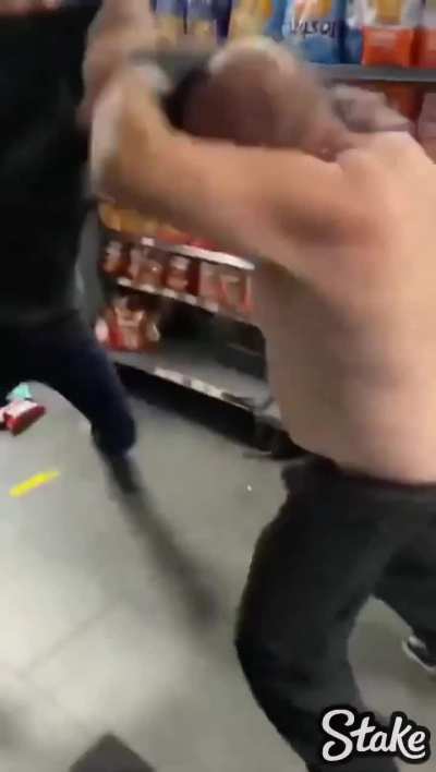 Two men fighting in a convenience store